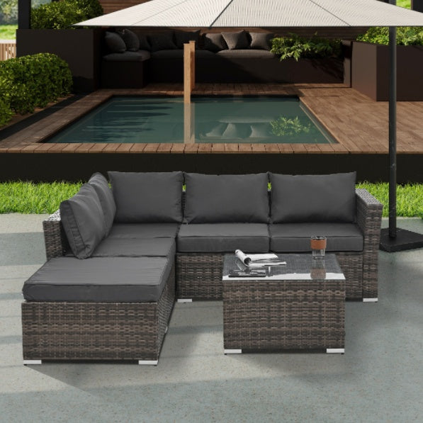 4-Piece PE Wicker Outdoor Patio Furniture Set with Tempered Glass & Coffee Table