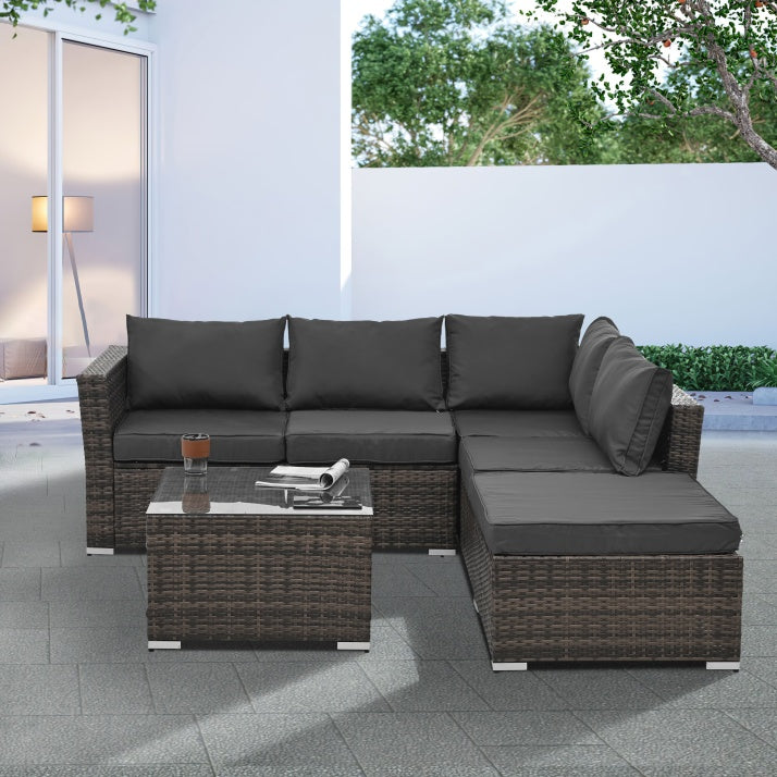 4-Piece PE Wicker Outdoor Patio Furniture Set with Tempered Glass & Coffee Table